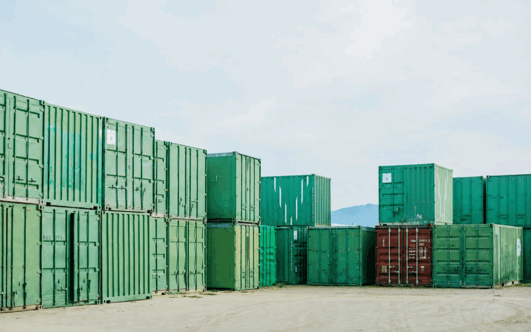 Stacked shipping containers of different sizes at Valley Containers.